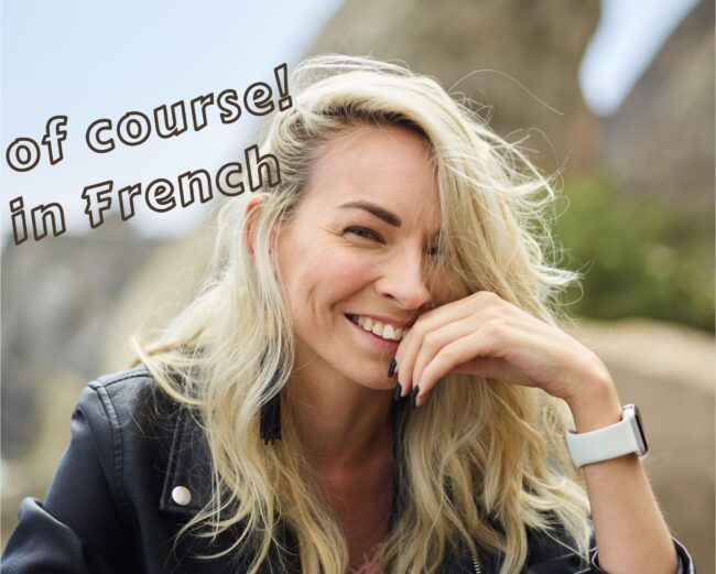 A smiling woman, with the text: Of Course in French